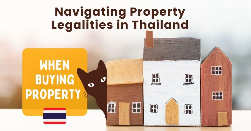 Legalities of Buying Property in Thailand with a cat appearing from behind houses.